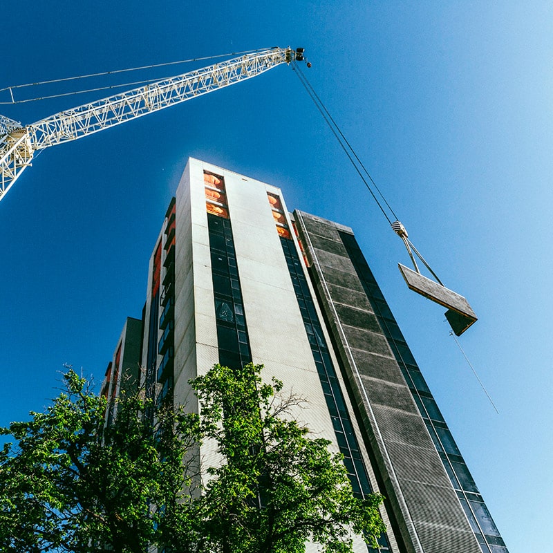 A construction crane working on building a high rise